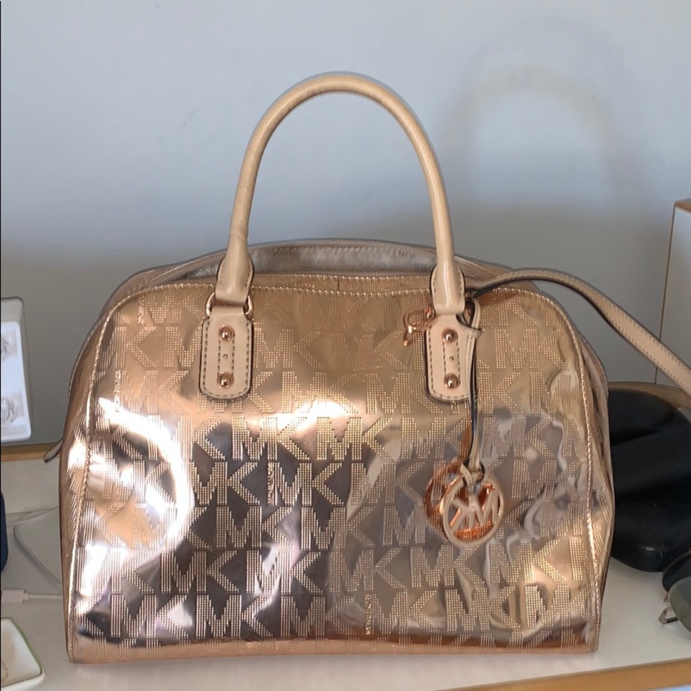 Michael Koros rose gold purse